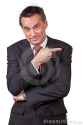 smiling-business-man-suit-pointing-right-19631405.jpg