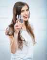 depositphotos_26238179-Woman-holding-water-glass.jpg