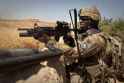 Defense.gov_News_Photo_110603-A-UJ825-032_-_U.S._Army_Sgt._1st_Class_Andre_Johnson_uses_a_wall_for_cover_as_he_stands_guard_near_a_wheat_field_in_Malajat_Kandahar_province_Afghanistan_on.jpg