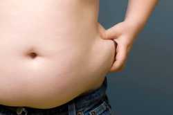 Overweight-Boy-pinching-fat-around-his-waist.jpg
