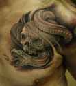 skull_and_snake_tattoo_on_chest_for_men.jpg.pagespeed.ce.pa6qaZn9aU.jpg
