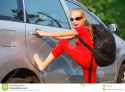 happy-girl-standing-near-car-ready-to-travel-41572193.jpg