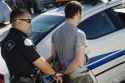 12548108-Police-Officer-Arresting-Young-Man-Stock-Photo-arrest-criminal.jpg