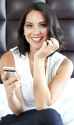 Olivia_Munn_cute_using_phone.jpg