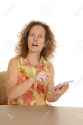 26837006-a-woman-with-a-confused-expressionon-her-face-pointing-at-her-tablet-.jpg