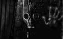 8506_man-with-gas-mask-on-his-face-looking-out-the-window.jpg