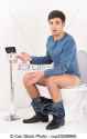 young-handsome-man-sitting-on-toilet-stock-image_csp23008965.jpg